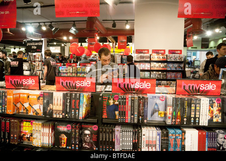 A man looking at DVD DVDs in the HMV sale, interior, HMV store, Cambridge branch, UK Stock Photo