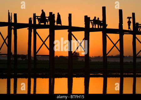 U Bein Bridge at sunset, Thaungthaman lake; Amarapura, Burma, Myanmar Stock Photo