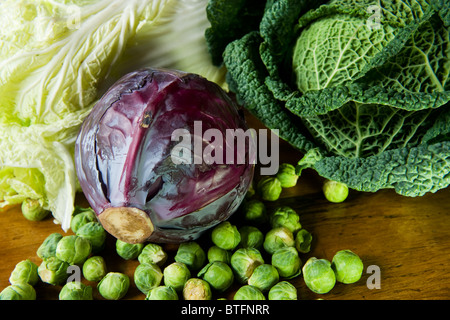 Still life with assortment cabbages on wooden table Stock Photo
