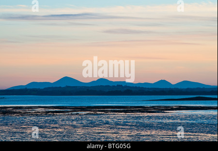 The Mourne Mountains at sunset, seen from Mount Stewart on the Ards Peninsula  looking across Strangford Lough, Northern Ireland Stock Photo