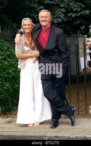 Radio and Television Presenter DJ Chris Tarrant and wife Ingrid arrive for outdoor party in Carlyle Square in Chelsea, London Stock Photo