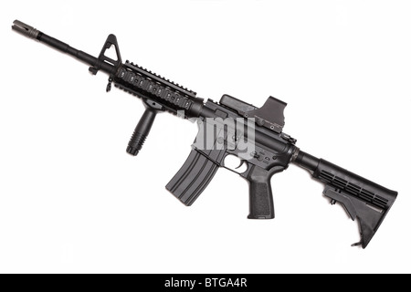 Weapon series. US Army M4A1 Carbine with tactical grip and holographic sight. Object isolated on white backgound. Stock Photo
