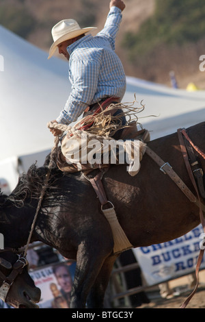 Redelsperger competes in the Saddle Bronc event at the San Dimas Rodeo in San Dimas on October 2, 2010. Stock Photo