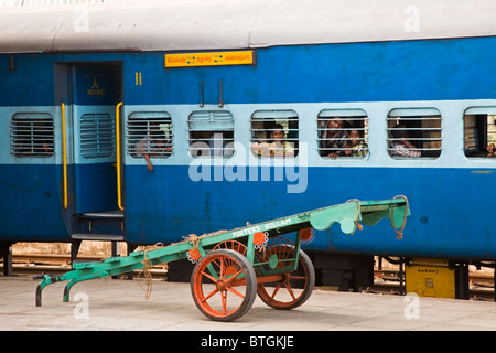 Maharastra to Kerala on Konkan railway. A porters trolley awaits baggage on Kollam's railway station Stock Photo