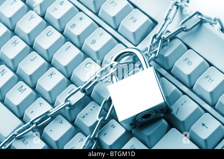 Computer keyboard secured with chain and padlock Stock Photo