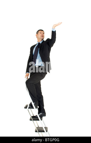 businessman on a ladder Stock Photo