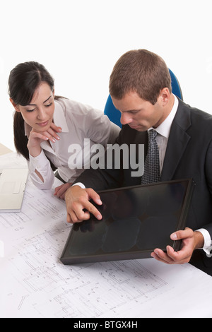 Man and woman looking at solar panel Stock Photo