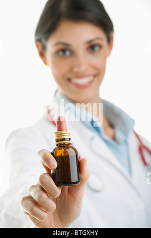 Doctor holding medicine bottle Stock Photo