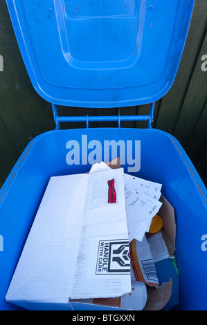 An open wheely bin showing bank statements etc. for identity fraud in the Uk Stock Photo