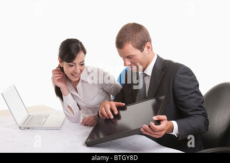 Man and woman looking at solar panel Stock Photo