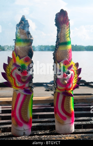 Giant incense sticks with dragon faces burning at Tua Pek Kong Temple in Sibu, Borneo Stock Photo