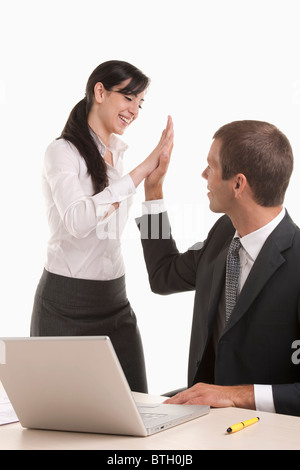 Man and woman doing high five Stock Photo