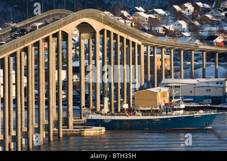 The city of Tromso and one of its two impressive bridges linking the island of Tromso to mainland Norway Stock Photo
