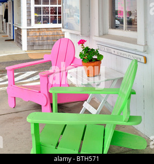 Colorful neon pink and lime green Adirondack beach chairs in Watch Hill, Rhode Island, United States USA Stock Photo
