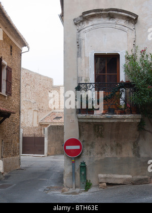 A beautiful old stone and iron balcony on a medieval house in Mornas, nr Orange, France Stock Photo