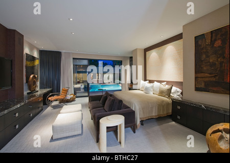 Lit bedroom of luxury California home Stock Photo