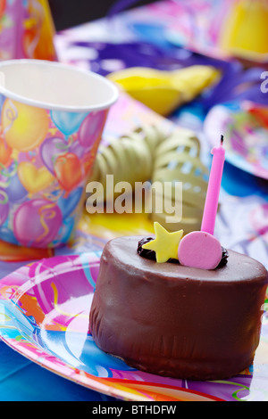 closeup of birthday party table decor and cake Stock Photo