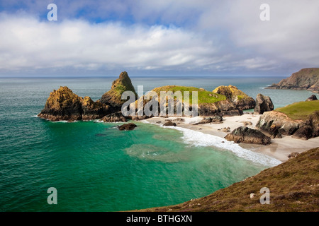 Turquoise sea, white sand and serpentine cliffs at Kynance Cove, Cornwall. Stock Photo