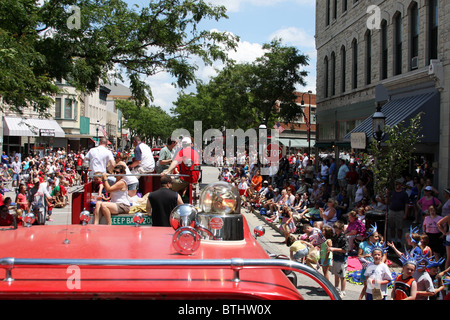 4th of July parade in Waukesha Wisconsin from the top of an antique fire engine truck Stock Photo