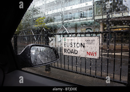 Euston Road sign in rain, through car window, London, England, United Kingdom Stock Photo