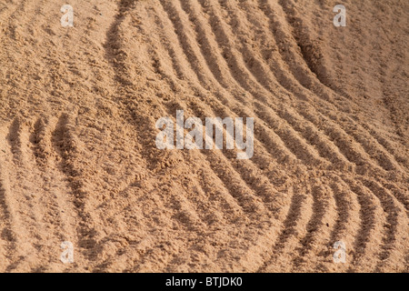 Sand Trap rake pattern in the sand Stock Photo