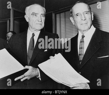 Henry R. Luce (1898-1967) and General Douglas MacArthur (1880-1964) holding hand-written pages of MacArthur's memoirs, that LIFE magazine had bought rights to publish. 1963. Stock Photo