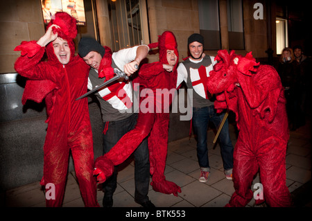 Five Men dressed as George and the Dragon for a Halloween fancy dress party night in Aberystwyth Wales UK Stock Photo