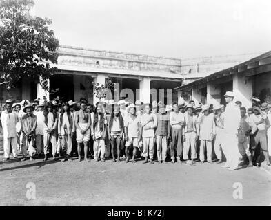 The Philippine–American War. Philipino prisoners of war, posed in courtyard. ca. 1899 Stock Photo