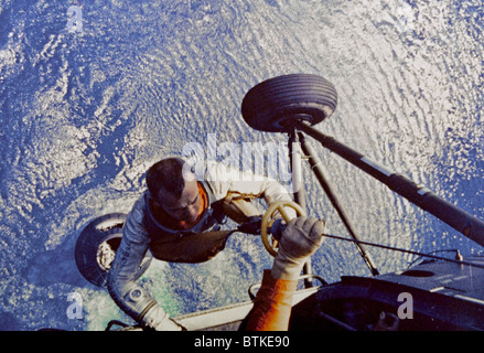 Astronaut Alan B. Shepard is hoisted aboard a U.S. Marine helicopter after splashdown of his Freedom 7 Mercury space capsule. Shepard was the first American, and second human after Russian Yuri Gargarin, to make a manned space flight. May 5, 1961. Stock Photo