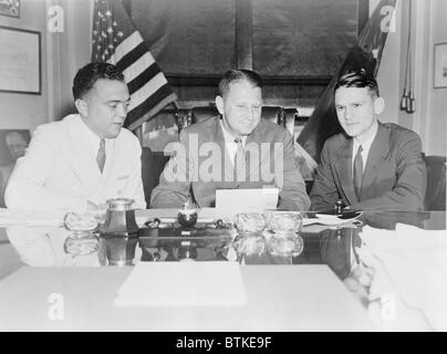 FBI Director J. Edgar Hoover and William Stanley, in a Justice Department meeting with Melvin H. Purvis, head of the Chicago FBI office. Purvis was personally reporting to Hoover about the killing of John Dillinger during his capture by the Special Agents on July 22, 1934. Stock Photo