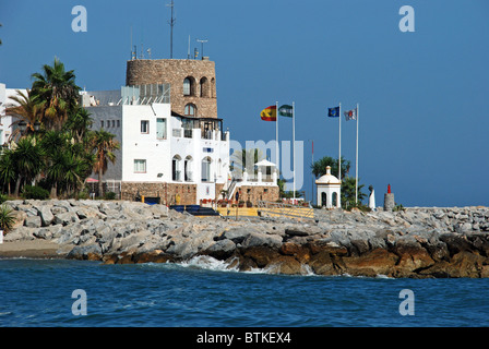 Harbour mouth and watchtower, Puerto Banus, Marbella, Costa del Sol, Malaga Province, Andalucia, Spain, Western Europe. Stock Photo