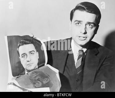 Edwin Herbert Land (1909-1991), American scientist and inventor, holding a polaroid photograph of himself, taken by the camera he invented. The instant photo process dominated the market from its introduction in 1947 until the emergence of popular digital photography in the 1990s. Stock Photo