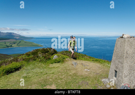 Father and son on the high peak of Mullach Mor, Holy Island, Arran Stock Photo