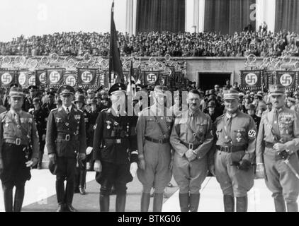 Adolf Hitler posed with Heinrich Himmler (third from left), Hermann Goring (second from right), and other Nazi officers in front of crowd, celebrating the Day of the Storm Troops, Nazi Party Day, Nuremberg. September 1935. Stock Photo