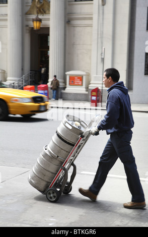 A beverage supplier with a hand truck, New York City, USA Stock Photo