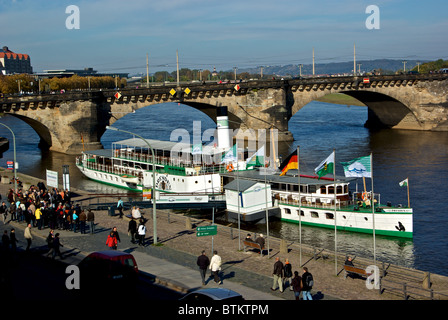 Passengers lining up to board river boat for scenic cruise tour along Elbe River Dresden Stock Photo