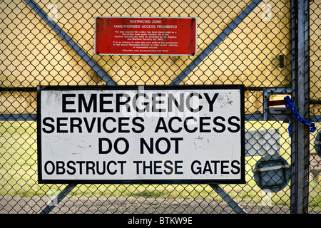 Security Perimeter Sign Security warning sign on the perimeter fence of an industrial unit ...