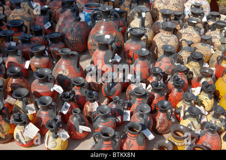 A selection of replicas of ancient Greek amphorae displayed at an outdoor pottery market. Crete, Greece. Stock Photo