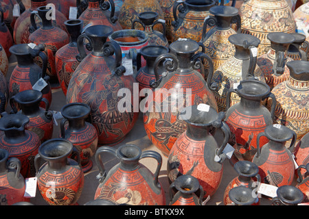 A selection of replicas of ancient Greek amphorae displayed at an outdoor pottery market. Crete, Greece. Stock Photo