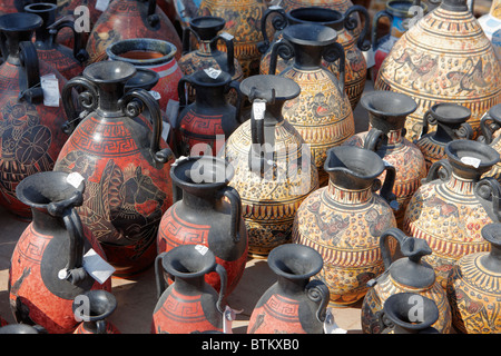 A selection of replicas of ancient Greek amphorae displayed at an outdoor pottery market. Crete, Greece. Stock Photo