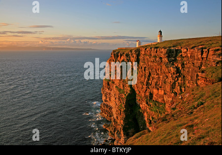 Evening light on the cliffs looking over the Pentland Firth to Orkney and the Island of Hoy Stock Photo