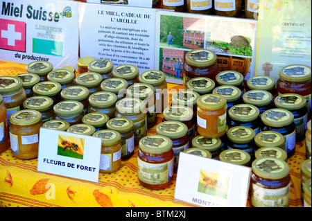 Swiss honey. Pots of Swiss honey for sale on a market stall Stock Photo