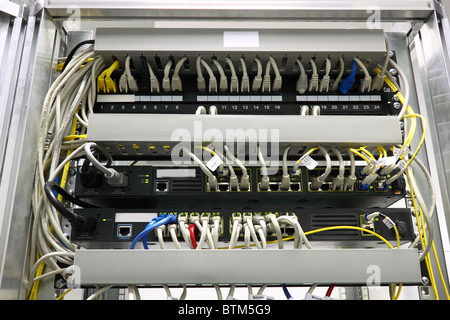 connected switches in technology room with fiber optic SFP ports Stock Photo