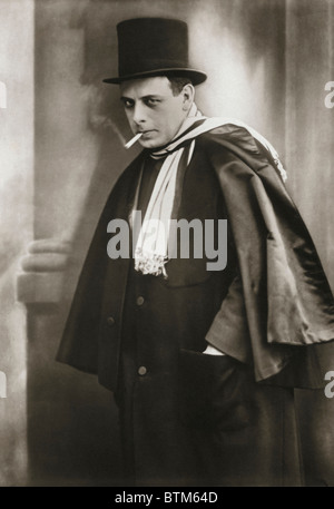 Historical photo (1910) of a man smoking a cigarette Stock Photo