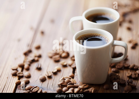 two modern espresso cups on a wooden table Stock Photo