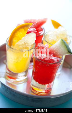 colourful icy fruit drinks on a tray Stock Photo