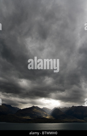 Dark moody sky over mountain range, new zealand Stock Photo