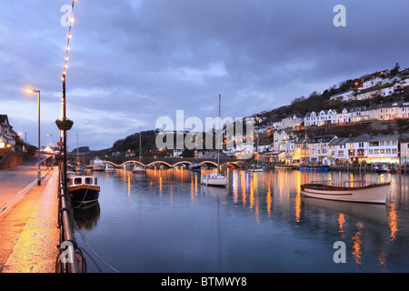 Boats on Looe River in south east Cornwall captured during twilight on a still winters evening. Stock Photo