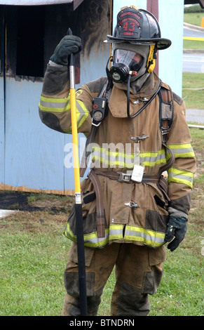 portrait of a firefighter in full turnout gear Stock Photo