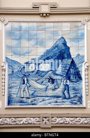 Old Madeiran scene painted on glazed blue tiles Funchal Madeira Portugal Stock Photo